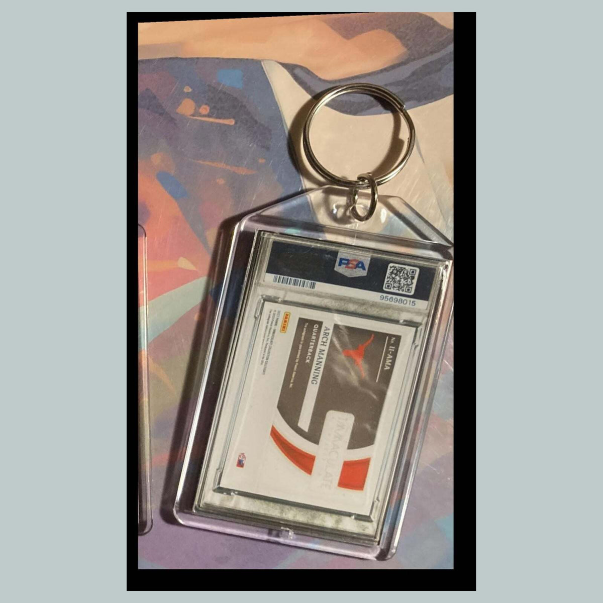 3495 Arch Manning 2023 Panini Immaculate Introductions Ruby Auto Custom Keychain